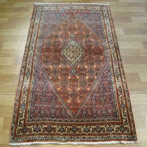 مشخصات،  قیمت و خرید فرش دستباف بيجار طرح لچک و ترنج سایز ذرع و نيم رنگ زمینه نارنجي رنگ حاشیه كرم | هنرظریف