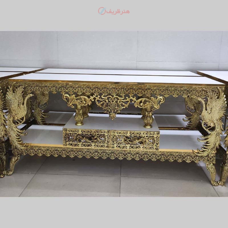 خرید، قیمت و مشخصات میز تلویزیون دو کشو، طرح طاووس تاجدار، جنس آلیاژ آلومینیوم با آبکاری برنز به قیمت تولیدی | هنرظریف
