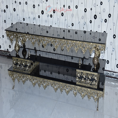 خرید، قیمت و مشخصات میز تلویزیون برنزی سه طبقه رویه شیشه و بدنه مقاوم و رنگ ثابت دارای ضمانت - هنرظریف