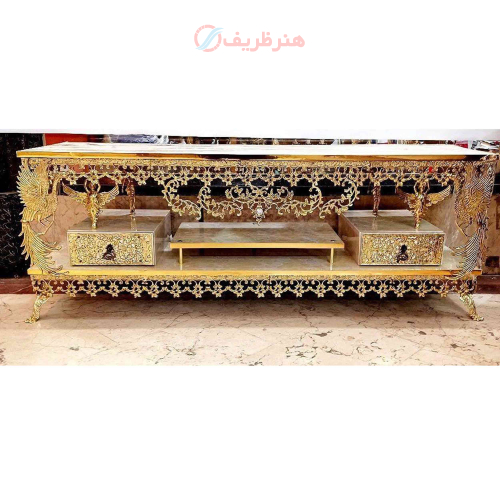 خرید، قیمت و مشخصات میز تلویزیون پر کار برنزی دو طبقه دارای دو کشو بسیار شکیل و خاص دارای ضمانت ارزان و باکیفیت _ هنرظریف