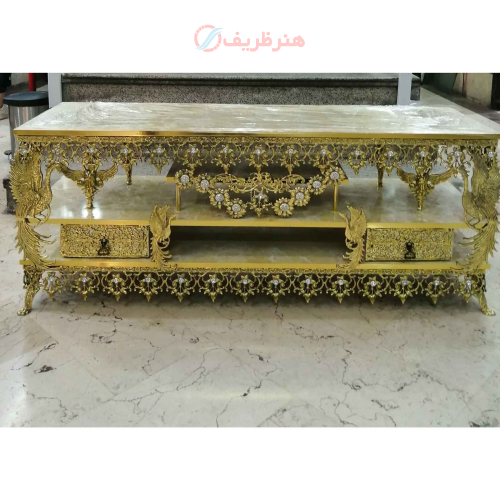 خرید، قیمت و مشخصات میز تلویزیون برنزی طرح گل آفتابگردان، دارای دو کشو طاووس دار ارزان و باکیفیت _ هنرظریف