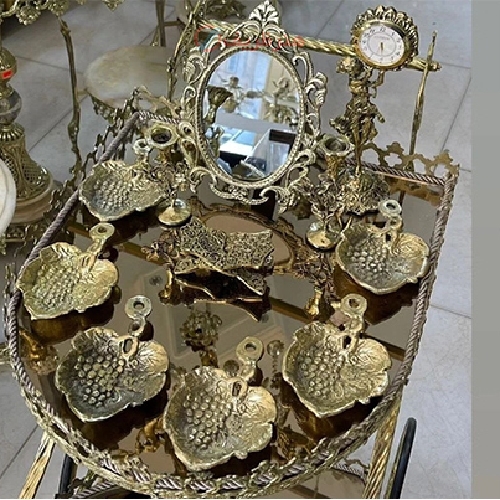 هفت سین برنزی مدل برگ و انگور، آینه گرد به همراه ساعت دلنشین