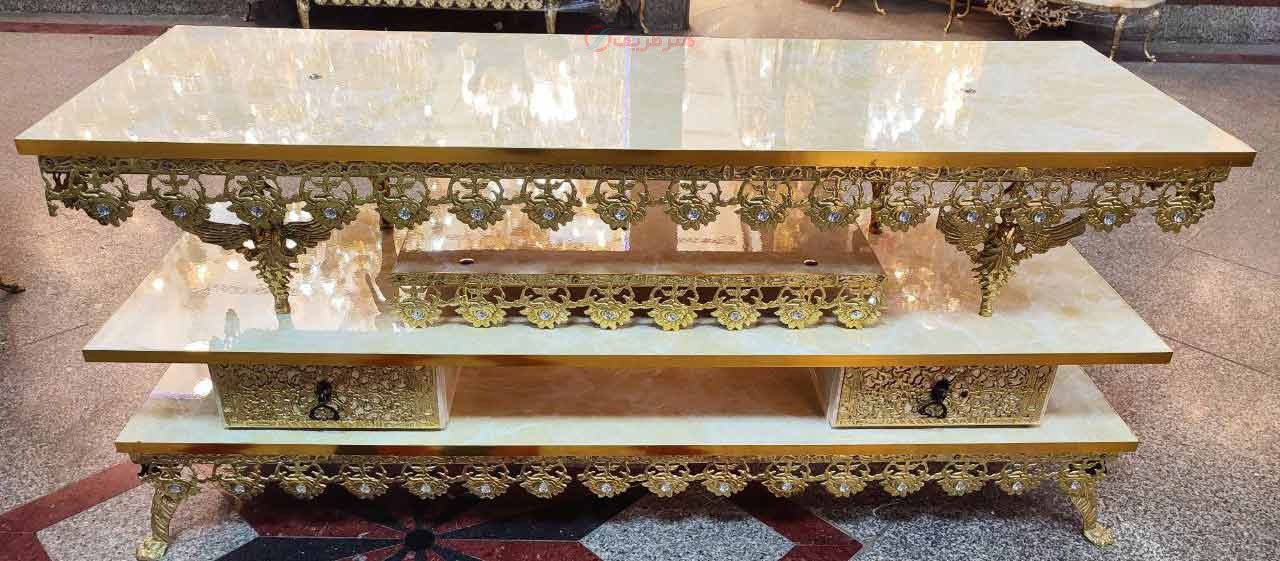 خرید، قیمت و مشخصات میز تلویزیون برنزی طرح گل رز با نوار طلایی با رویه هایگلس به قیمت تولیدی | هنرظریف