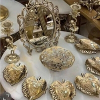 خرید، قیمت و مشخصات هفت سین برنجی طرح برگ به همراه آینه و شمعدان به طور مستقیم از تولیدی | هنرظریف