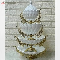 خرید آنلاین، ظروف سرامیکی چهار تکه، رنگ ثابت شامل شیرینی خوری و میوه خوری و اجیل خوری و شکلات خوری، با پایه های برنزی طلایی رنگ، زیر قیمت بازار | هنرظریف