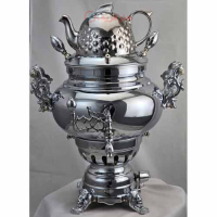 خرید، قیمت و مشخصات سماور برنجی قلمزنی با روکش کروم براق و پایه‌های شیر _ هنرظریف